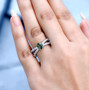 green apatite and white zircon split shank ring in rhodium over sterling silver worn on a hand