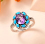 rose de france amethyst turquoise and white zircon halo ring in rhodium over sterling silver shown in a lifestyle photo
