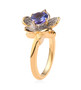 side view of tanzanite and white zircon flower ring in 18k yellow gold over sterling silver