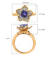 tanzanite and white zircon flower ring in 18k yellow gold over sterling silver shown for size comparison