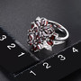 black garnet and white zircon floral cluster ring in rhodium over sterling silver