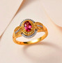 rubellite tourmaline yellow sapphire and moissanite ring in 18k yellow gold over sterling silver shown in a lifestyle photo