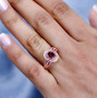 rubellite tourmaline pink sapphire and moissanite ring in 18k rose gold over sterling silver worn on a hand