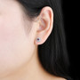 rhodolite garnet and zircon round halo stud earrings on rhodium over sterling silver worn on the ear