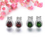 close up of garnet pear halo stud earrings in rhodium over sterling silver