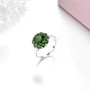 close up of chrome diopside round halo ring in rhodium over sterling silver
