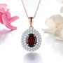 garnet and white zircon double halo pendant necklace in 18k rose gold over sterling silver shown in a lifestyle photo