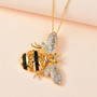 citrine black spinel chrome diopside and zircon bee pendant necklace in 18k yellow gold over sterling silver shown in a lifestyle photo