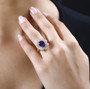 amethyst and white zircon flower ring in 18k yellow gold over sterling silver worn on a hand
