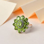 peridot and white zircon halo ring in rhodium over sterling silver shown in a lifestyle photo