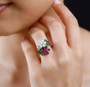 opal chrome diopside rhodolite garnet and zircon flower cluster ring in 18k rose gold over sterling silver worn on a hand