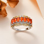 fire opal and white zircon band ring in 18k yellow gold and rhodium over sterling silver shown in a lifestyle photo