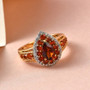 madeira citrine fire opal and white zircon pear halo ring in 18k yellow gold over sterling silver shown in a lifestyle photo