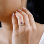 amethyst rhodolite garnet and moissanite heart bypass ring in 18k yellow gold over sterling silver worn on a hand