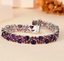 amethyst and rhodolite garnet tennis bracelet in rhodium over sterling silver shown in a lifestyle photo