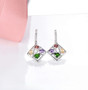 chrome diopside amethyst citrine and garnet openwork dangle earrings in rhodium over sterling silver shown in a lifestyle photo