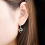 chrome diopside amethyst citrine and garnet openwork dangle earrings in rhodium over sterling silver worn on the ear