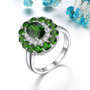 chrome diopside and white zircon halo ring in rhodium over sterling silver shown in a lifestyle photo