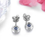 back view of tanzanite and white zircon round halo stud earrings in rhodium over sterling silver