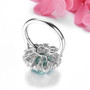 back view of green fluorite and white zircon halo ring in rhodium over sterling silver