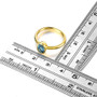 london blue topaz oval bezel set solitaire ring in 18k yellow gold over sterling silver shown for size comparison
