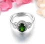 front view of chrome diopside and white zircon halo ring in rhodium over sterling silver