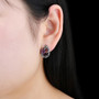 rhodolite garnet and multi gemstone earrings in black rhodium over sterling silver worn on the ear