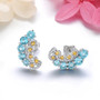 blue topaz citrine and white zircon earrings in rhodium over sterling silver shown in a lifestyle photo