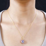 tanzanite pink tourmaline and white zircon halo pendant necklace in 18k yellow gold over sterling silver worn around the neck