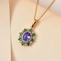 tanzanite pink tourmaline and white zircon halo pendant necklace in 18k yellow gold over sterling silver shown in a lifestyle photo