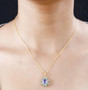 tanzanite pink tourmaline and white zircon halo pendant necklace in 18k yellow gold over sterling silver worn around the neck