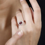 rubellite tourmaline and white zircon heart halo ring in 18k rose gold over sterling silver worn on a hand
