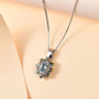 aquamarine and multi color diamond halo pendant necklace in rhodium over sterling silver shown in a lifestyle photo