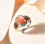 peach moonstone citrine and white zircon ring in rhodium over sterling silver shown in a lifestyle photo