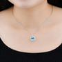 sky blue topaz and white zircon halo pendant necklace in rhodium over sterling silver worn around the neck
