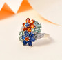 multi color kyanite flower ring with white zircon accents in rhodium over sterling silver shown in a lifestyle photo