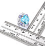 sky blue topaz tanzanite and white zircon halo earrings in rhodium over sterling silver shown for size comparison