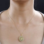 heliodor yellow sapphire and moissanite sunburst cluster pendant necklace in 18k yellow gold over sterling silver worn around the neck