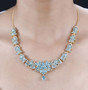 chrome diopside and white zircon flower cluster necklace in 18k yellow gold over sterling silver worn around the neck