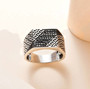 black diamond chain link gents ring in black and white rhodium over sterling silver shown in a lifestyle photo