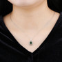 chrome diopside and white zircon halo pendant necklace in rhodium over sterling silver worn around the neck