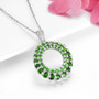 side view of chrome diopside and white zircon round cluster pendant necklace in rhodium over sterling silver