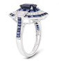 angled view of sapphire and white diamond 14k white gold vintage inspired halo ring