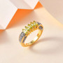 sphene marquise five stone ring with white zircon in 18k yellow gold over sterling silver shown in a lifestyle photo
