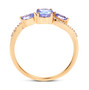 side view of tanzanite and white diamond trilogy ring in solid 14k yellow gold