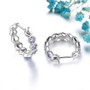 back view of tanzanite honeycomb hoop earrings in rhodium over sterling silver