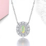 ethiopian opal and white zircon double halo necklace in rhodium over sterling silver shown in a lifestyle photo