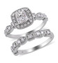 princess and round diamond halo bridal set in 14k white gold