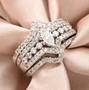 marquise and round diamond three ring bridal set in 14k white gold shown in a lifestyle photo