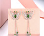 close up of chrome diopside butterfly dangle earrings in rhodium over sterling silver